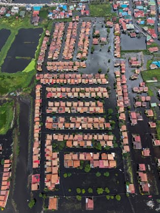 Monsoon rains flood multiple places in Philippines as tens of thousands displaced PAMPANGA, PHILIPPINES - AUGUST 20: An aerial view of a seriously flooded residential area due to monsoon rains, in Apalit, Pampanga, Philippines, on August 20, 2026. The lingering monsoon effects, compounded with the intensifying tropical storm Saudel that is expected to turn into a typhoon, have recently brought humongous rains to the Philippines, causing widespread, serious flooding in multiple areas across 10 different regions, including those on Central Luzon. As a result, tens of thousands of people across the Southeast Asian country have been displaced or evacuated to safety. Daniel Ceng Anadolu Pampanga Philippines. Editorial use only. Please get in t  Copyright: x2026xAnadoluxDanielxCengx