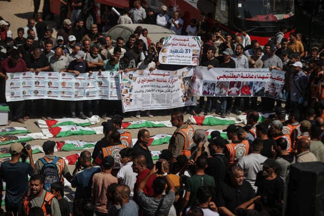 Funeral held for 50 Palestinians recovered from rubble at Al-Shifa Hospital in Gaza GAZA CITY, GAZA, PALESTINE - AUGUST 20: Relatives and local residents attend the funeral ceremony for 50 Palestinians, whose bodies were recovered from the rubble of buildings destroyed in intense Israeli bombardments, at the courtyard of Al-Shifa Medical Complex in Gaza City, Gaza, Palestine on August 20, 2026. Following extensive search and rescue operations by Palestinian Civil Defense teams, the recovered bodies were brought to the medical complex before being laid to rest by grieving families and community members. Ali Jadallah Anadolu Gaza City Gaza. Editorial use only. Please get in touch for any other usage.  Copyright: x2026xAnadoluxAlixJadallahx
