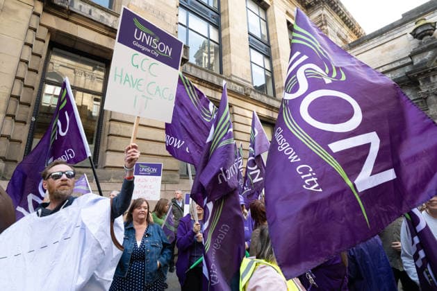 August 20, 2026, Glasgow, Scotland, UK: Members of the Unite, UNISON and GMB unions held a protest outside Glasgow City Chambers to coincide with a vote on a new pay and grading scheme for council employees. The unions claim the councils proposals would adversely affect low-paid workers, particularly women, who they say have been underpaid for two decades. Glasgow UK - ZUMAs357 20260820_zip_s357_003 Copyright: xCameronxScottx