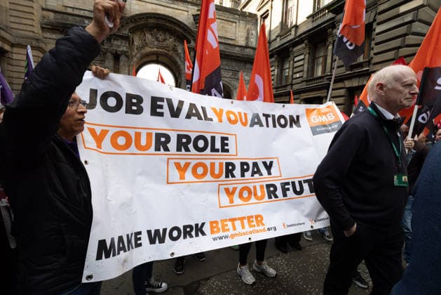 August 20, 2026, Glasgow, Scotland, UK: Members of the Unite, UNISON and GMB unions held a protest outside Glasgow City Chambers to coincide with a vote on a new pay and grading scheme for council employees. The unions claim the councils proposals would adversely affect low-paid workers, particularly women, who they say have been underpaid for two decades. Glasgow UK - ZUMAs357 20260820_zip_s357_005 Copyright: xCameronxScottx