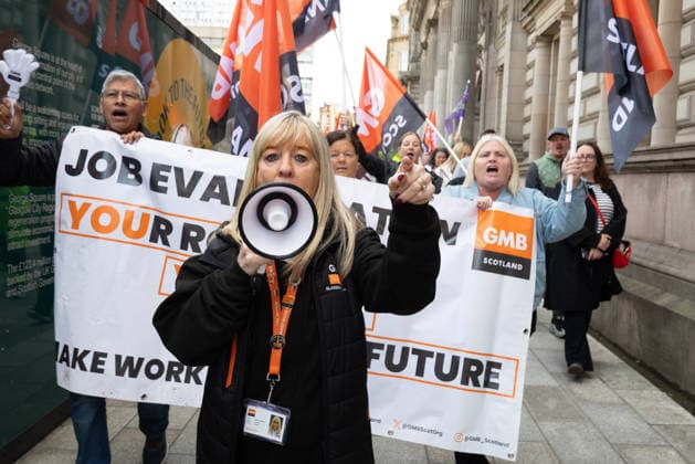 August 20, 2026, Glasgow, Scotland, UK: Members of the Unite, UNISON and GMB unions held a protest outside Glasgow City Chambers to coincide with a vote on a new pay and grading scheme for council employees. The unions claim the councils proposals would adversely affect low-paid workers, particularly women, who they say have been underpaid for two decades. Glasgow UK - ZUMAs357 20260820_zip_s357_006 Copyright: xCameronxScottx