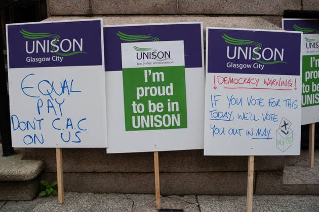 August 20, 2026, Glasgow, Scotland, UK: Members of the Unite, UNISON and GMB unions held a protest outside Glasgow City Chambers to coincide with a vote on a new pay and grading scheme for council employees. The unions claim the councils proposals would adversely affect low-paid workers, particularly women, who they say have been underpaid for two decades. Glasgow UK - ZUMAs357 20260820_zip_s357_013 Copyright: xCameronxScottx