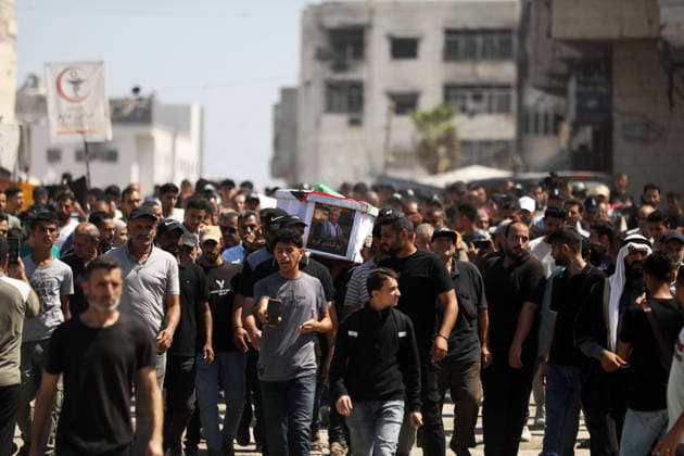 Palestinians Attend Funeral for 50 Bodies Recovered in Gaza City Palestinians attend a funeral for the remains of 50 people recovered from beneath the rubble of buildings destroyed in Israeli strikes during the war, in Gaza City, on August 20, 2026. Civil Defense crews continue search and recovery operations for bodies trapped under the rubble. Photo by Bilal Osama apaimages Gaza city Gaza Strip Palestinian Territory 200826_Gaza_BO_00(38) Copyright: xapaimagesxBilalxOsamax xapaimagesx