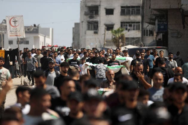 Palestinians Attend Funeral for 50 Bodies Recovered in Gaza City Palestinians attend a funeral for the remains of 50 people recovered from beneath the rubble of buildings destroyed in Israeli strikes during the war, in Gaza City, on August 20, 2026. Civil Defense crews continue search and recovery operations for bodies trapped under the rubble. Photo by Bilal Osama apaimages Gaza city Gaza Strip Palestinian Territory 200826_Gaza_BO_00(40) Copyright: xapaimagesxBilalxOsamax xapaimagesx