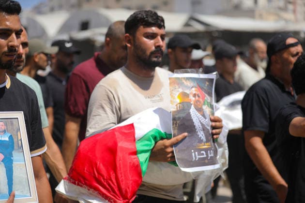 Palestinians Attend Funeral for 50 Bodies Recovered in Gaza City Palestinians attend a funeral for the remains of 50 people recovered from beneath the rubble of buildings destroyed in Israeli strikes during the war, in Gaza City, on August 20, 2026. Civil Defense crews continue search and recovery operations for bodies trapped under the rubble. Photo by Bilal Osama apaimages Gaza city Gaza Strip Palestinian Territory 200826_Gaza_BO_00(63) Copyright: xapaimagesxBilalxOsamax xapaimagesx
