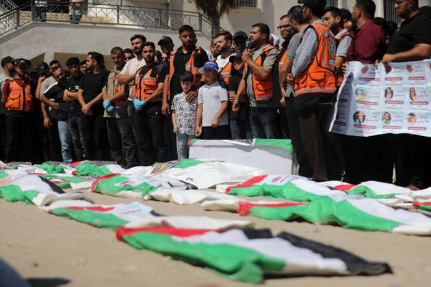 Palestinians Attend Funeral for 50 Bodies Recovered in Gaza City Palestinians attend a funeral for the remains of 50 people recovered from beneath the rubble of buildings destroyed in Israeli strikes during the war, in Gaza City, on August 20, 2026. Civil Defense crews continue search and recovery operations for bodies trapped under the rubble. Photo by Bilal Osama apaimages Gaza city Gaza Strip Palestinian Territory 200826_Gaza_BO_00(12) Copyright: xapaimagesxBilalxOsamax xapaimagesx