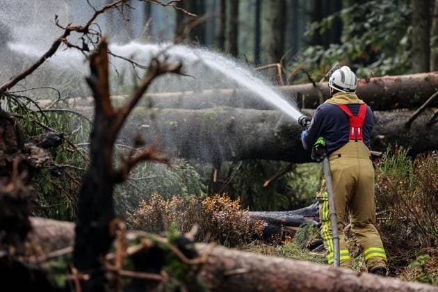 Firefighters continue to work, wetting the soil on the site of the fires in the Hautes Fagnes (High Fens) nature reserve, on Thursday 20 August 2026. The fire started on August 14th and 3000 hectares (on a total of 4500) are impacted.  JULIENxWARNAND 183822646