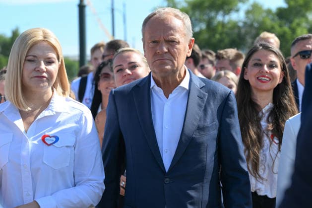Polish Prime Minister Tusk announces tourist tax reform during Krakow mayoral endorsement KRAKOW, POLAND - AUGUST 20: Polish Prime Minister Donald Tusk and Civic Coalition (KO) Senator Monika Piatkowska arrive accompanied by campaign supporters for a joint press briefing outside the ICE Krakow Congress Centre in Krakow, Poland, on August 20, 2026. Tusk officially endorsed Piatkowska’s bid in the snap mayoral election under the civic ballot committee Beyond Divisions and announced a major legislative policy shift under which 100 percent of revenues from the upcoming national tourist fee would go directly to municipal budgets rather than being shared with the central treasury. Artur Widak Anadolu Krakow Poland. Editorial use only. Please  Copyright: x2026xAnadoluxArturxWidakx