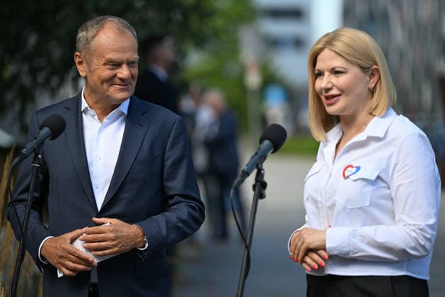 Polish Prime Minister Tusk announces tourist tax reform during Krakow mayoral endorsement KRAKOW, POLAND - AUGUST 20: Polish Prime Minister Donald Tusk and Civic Coalition (KO) Senator Monika Piatkowska react during a joint press briefing outside the ICE Krakow Congress Centre in Krakow, Poland, on August 20, 2026. Tusk officially endorsed Piatkowska’s snap mayoral bid under the civic ballot committee Beyond Divisions and announced a major legislative policy shift ensuring that 100 percent of revenues from the upcoming national tourist-compensatory fee will go directly to municipal budgets rather than being shared with the central treasury. Artur Widak Anadolu Krakow Poland. Editorial use only. Please get in touch for any other usage.  Copyright: x2026xAnadoluxArturxWidakx