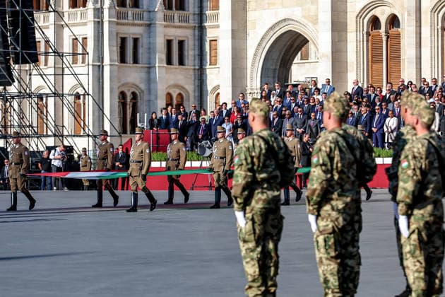 (260820) -- BUDAPEST, Aug. 20, 2026 -- This photo taken on Aug. 20, 2026 shows a flag-raising and military oath-taking ceremony at Kossuth Square in front of the parliament building in Budapest, Hungary. Hungary marks its national day on Thursday with traditional ceremonies, music concerts, and a redesigned evening spectacle in Budapest. (Photo by Xinhua) HUNGARY-BUDAPEST-NATIONAL DAY-CELEBRATION DavidxBalogh 