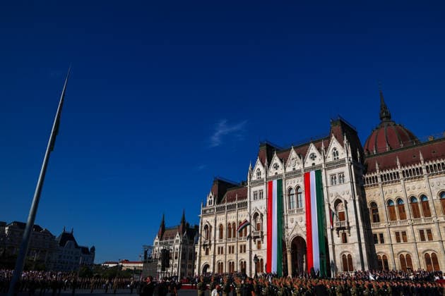 (260820) -- BUDAPEST, Aug. 20, 2026 -- This photo taken on Aug. 20, 2026 shows a flag-raising and military oath-taking ceremony at Kossuth Square in front of the parliament building in Budapest, Hungary. Hungary marks its national day on Thursday with traditional ceremonies, music concerts, and a redesigned evening spectacle in Budapest. (Photo by Xinhua) HUNGARY-BUDAPEST-NATIONAL DAY-CELEBRATION DavidxBalogh 