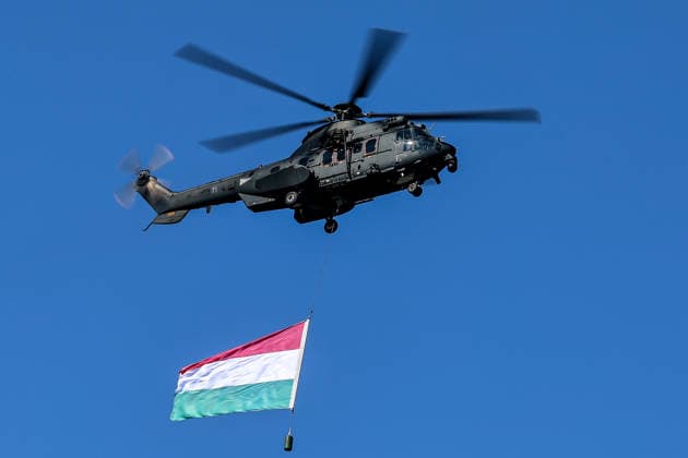 (260820) -- BUDAPEST, Aug. 20, 2026 -- A Hungarian Air Force helicopter participates in a military air parade over the Danube in Budapest, Hungary, on Aug. 20, 2026. Hungary marks its national day on Thursday with traditional ceremonies, music concerts, and a redesigned evening spectacle in Budapest. (Photo by Xinhua) HUNGARY-BUDAPEST-NATIONAL DAY-CELEBRATION DavidxBalogh 