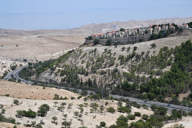 A view of houses in the Ma ale Adumum in the E1 area, where the Israeli government plans to build Jewish housing units in the E1 settlement project, in the eastern edge of the Judean Desert, West Bank, on Thursday, August 20, 2026. The Israeli Ministry of Housing published and opened bidding for a new tender for 1,234 housing units on August 18, 2026.  JER2026082001 DEBBIExHILL