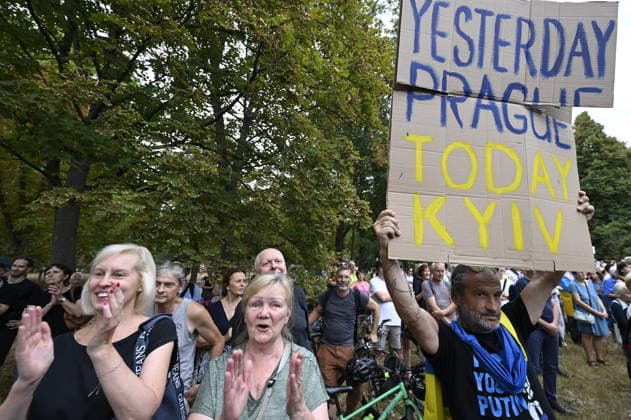 The meeting entitled Go Home, Ivan! on anniversary of 1968 occupation of Czechoslovakia by Warsaw Pact troops and expressing solidarity with people in Ukraine took place on the Boris Nemtsov Square, in Prague, Czech Republic, on August 20, 2026. The banner reads YESTERDAY PRAGUE. TODAY KYIV . (CTKxPhoto MichalxKrumphanzl) CTKPhotoP2026082006553  CTKPhotoP2026082006553