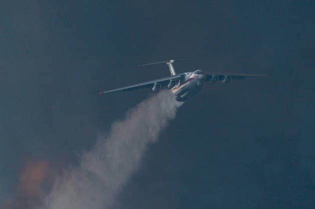 August 20, 2026, Grebenac, Vojvodina, Serbia: 2026820, Grebenac, Serbia - An Ilyushin Il-76 aircraft belonging to the Russian Ministry of Emergency Situations (EMERCOM) drops water over a massive wildfire in the Deliblato Sands (Deliblatska Pescara) Special Nature Reserve. The Russian water bomber was deployed to assist Serbian emergency services in battling the blaze in the strictly protected natural area, often referred to as the European Sahara. Grebenac Serbia  - ZUMAd223 20260820_zip_d223_002 Copyright: xMarkoxDimicx