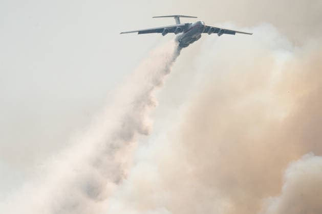 August 20, 2026, Grebenac, Vojvodina, Serbia: 2026820, Grebenac, Serbia - An Ilyushin Il-76 aircraft belonging to the Russian Ministry of Emergency Situations (EMERCOM) drops water over a massive wildfire in the Deliblato Sands (Deliblatska Pescara) Special Nature Reserve. The Russian water bomber was deployed to assist Serbian emergency services in battling the blaze in the strictly protected natural area, often referred to as the European Sahara. Grebenac Serbia - ZUMAd223 20260820_zip_d223_005 Copyright: xMarkoxDimicx