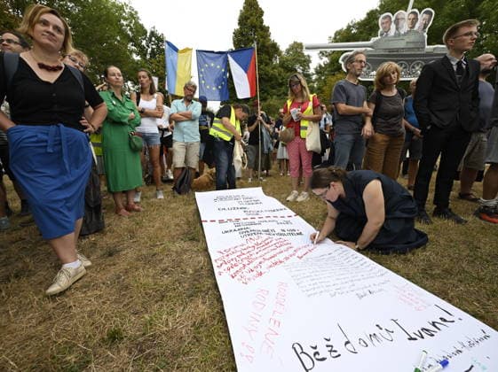 The meeting entitled Go Home, Ivan! on anniversary of 1968 occupation of Czechoslovakia by Warsaw Pact troops and expressing solidarity with people in Ukraine took place on the Boris Nemtsov Square, in Prague, Czech Republic, on August 20, 2026. Participants created a symbolic bill of exchange for Russian imperialism, several meters long. On a long sheet, they wrote what they believed to be the bill for decades of Soviet and Russian imperial policies - from the occupation of Czechoslovakia to the current war against Ukraine. (CTKxPhoto MichalxKrumphanzl) CTKPhotoP2026082006689  CTKPhotoP2026082006689