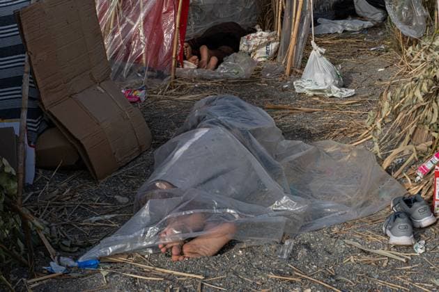 Migrants live in makeshift settlement on Ceuta beach CEUTA, SPAIN, AUGUST 20, 2026: Hundreds of migrants live in a makeshift settlement at Trampolin Beach in Ceuta, using shelters built from reeds, plastic and other discarded materials. Ceuta Spain Copyright: x xClaudioxPalmax xJNAxPressx