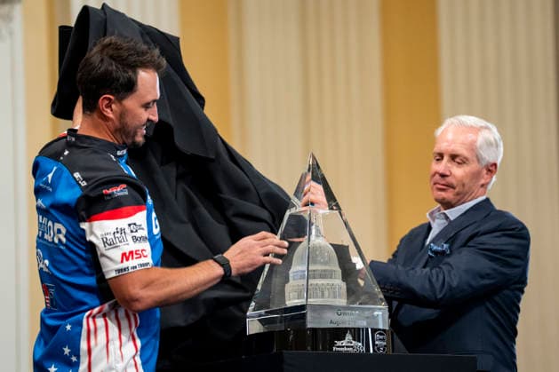 Freedom 250 Grand Grand Prix Chairman and President of Penske Corporation Bud Denker (R) and Graham Rahal, driver of the No. 15 Honda for Rahal Letterman Lanigan Racing, unveil the Owner s Trophy during a media preview for the Freedom 250 Grand Prix on Capitol Hill in Washington, DC on Thursday, August 20, 2026. The Freedom 250 Grand Prix, taking place August 22-23, is the first auto race on the National Mall and features seven turns within a with a 1.66 mile course around Washington s landmarks.  WAP20260820302 BONNIExCASH