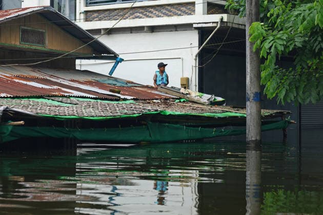 August 20, 2026, Ngathaingchaung, Ayeyarwady Region, Myanmar: A resident remains inside a flooded house in Ngathaingchaung Township, Ayeyarwady Region, Myanmar..In Laymyethna Township, Ayeyarwady Region, the Ngawun River embankment collapsed on July 31, leaving nearby towns including Hinthada, Yegyi, Ngathaingchaung, Kyonpyaw and Kyaunggon still inundated for three weeks, affecting tens of thousands of people, officials said. Ngathaingchaung Myanmar  - ZUMAn324 20260820_zip_n324_008 Copyright: xAyexMyaxNaingx