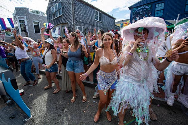 August 20, 2026, Provincetown, Massachusetts, USA: People watch from the street as costumed revelers take part in the annual Carnival Parade in Provincetown, Massachusetts on August 20, 2026. Provincetown USA - ZUMAp158 20260820_aap_p158_058 Copyright: xJosephxPreziosox