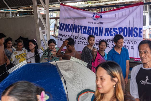Red Cross Relief Operations In San Mateo, Rizal, Philippines Volunteers from the Philippine Red Cross distribute relief packs to residents affected by floods from the Southwest Monsoon in an evacuation facility in Barangay Sta Ana, San Mateo, Rizal, Philippines, on August 20. Weather conditions across Luzon generally improved as a Low Pressure Area, formerly Tropical Depression Nesat, and the enhanced southwest monsoon, known as habagat, began to weaken. Northern and Central Luzon experienced improving skies with fewer heavy downpours, while Metro Manila and other areas saw intermittent sun breaks and isolated thunderstorms. San Mateo, Rizal Province Philippines  Copyright: xMelvinxJamesxUrubiox originalFilename: urubio-reliefop260820_npCkn.jpg