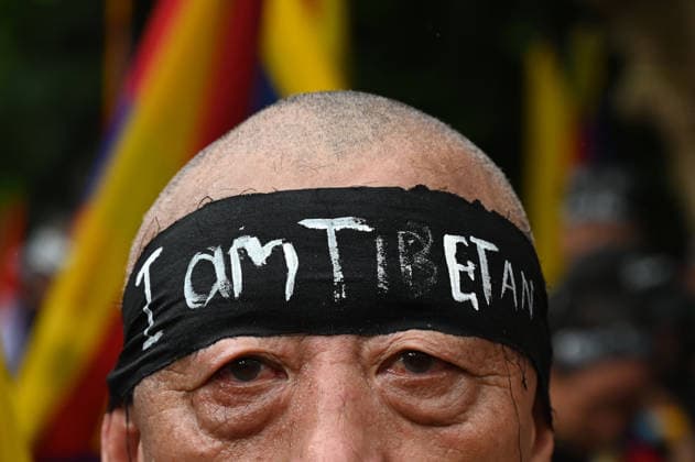 KOLKATA, INDIA - AUGUST 20: Members of the Tibetan community and local human rights activists shout anti-China slogans and shave their heads in protest to oppose Beijing s restrictive Promoting Ethnic Unity and Progress Law outside the Chinese Consulate General on August 20, 2026 in Kolkata, India. Protesters also observed the 49th-day traditional Buddhist mourning rites for activist Lobsang Palden (Lobga Rangzen), who committed self-immolation outside the United Nations headquarters in New York to draw global attention to conditions in Tibet. (Photo by Samir Jana Hindustan Times) Tibetan Activists Protesting Outside The Chinese Consulate In Kolkata Against Ethnic Unity Law