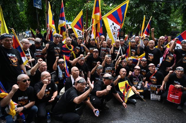 KOLKATA, INDIA - AUGUST 20: Members of the Tibetan community and local human rights activists shout anti-China slogans and shave their heads in protest to oppose Beijing s restrictive Promoting Ethnic Unity and Progress Law outside the Chinese Consulate General on August 20, 2026 in Kolkata, India. Protesters also observed the 49th-day traditional Buddhist mourning rites for activist Lobsang Palden (Lobga Rangzen), who committed self-immolation outside the United Nations headquarters in New York to draw global attention to conditions in Tibet. (Photo by Samir Jana Hindustan Times) Tibetan Activists Protesting Outside The Chinese Consulate In Kolkata Against Ethnic Unity Law