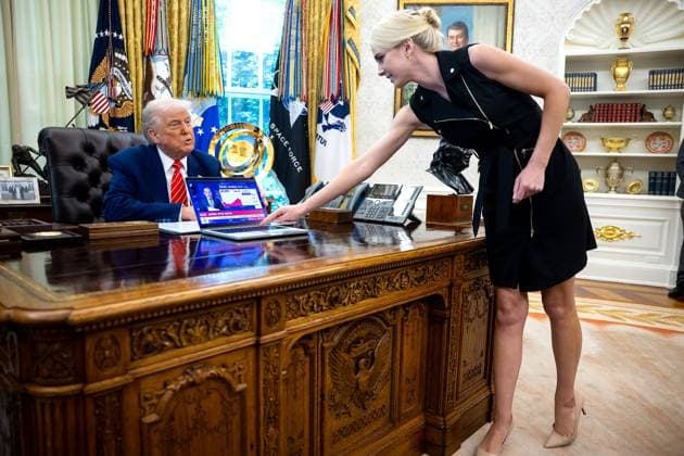 August 20, 2026: NATALIE HARP, a White House aide, is becoming a household name stemming from a comment by Sen. Jon Ossoff, D-Ga., who claimed Trump would rather build a ballroom and travel with Natalie than do his job as president. FILE PHOTO SHOT ON: May 30, 2025, Washington, DC, USA: US President DONALD TRUMP looks on as Natalie Harp, an aide, places a computer displaying a news report about the stock market, during a press conference with Elon Musk, Chief Executive Officer, Tesla, SpaceX and X and Administrator, Department of Government Efficiency (DOGE), in the Oval Office of the White House in Washington, DC. Washington USA - ZUMAs152 20250530_new_s152_033 Copyright: xFrancisxChung Poolx