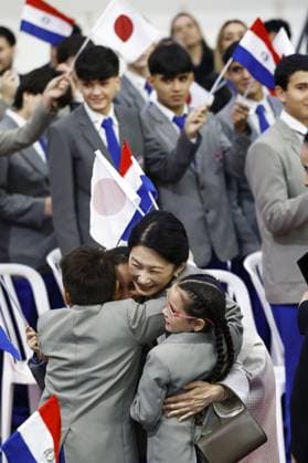 Japan crown prince, crown princess in Paraguay Japan s Crown Princess Kiko hugs students as she and Crown Prince Fumihito are seen off following their visit to a Japanese school near Asuncion, Paraguay, on Aug. 20, 2026, during their official trip to the South American country.  A14AA0005626358P