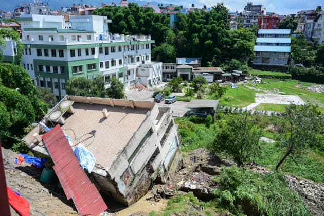 August 21, 2026, Kathmandu, Bagmati, Nepal: A two-and-a-half-storey house is seen collapsed after the ground beneath it sank due to rainfall in Bansbari, Kathmandu, Nepal, on August 21, 2026. No human casualties were reported in the incident. Kathmandu Nepal - ZUMAs330 20260821_zsp_s330_001 Copyright: xSafalxPrakashxShresthax