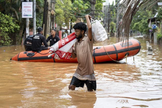 Heavy monsoon rains cause floodings in Assam GUWAHATI, ASSAM, INDIA - AUGUST 21: Residents walks through dirty water of a flooded street after heavy monsoon rains in Guwahati, India on August 21, 2026. David Talukdar Anadolu Guwahati India. Editorial use only. Please get in touch for any other usage.  Copyright: x2026xAnadoluxDavidxTalukdarx