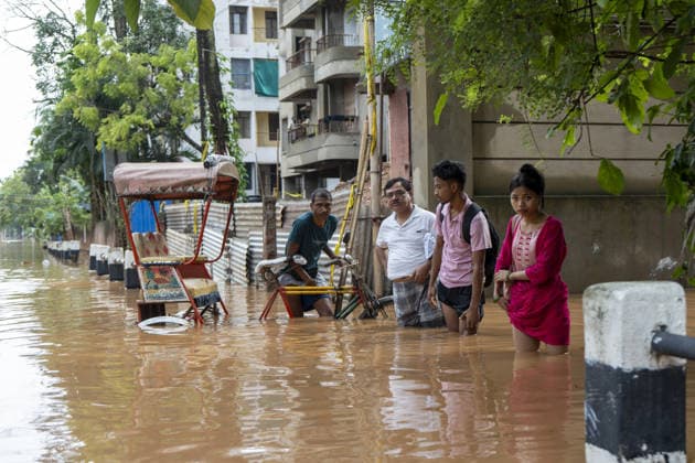 Heavy monsoon rains cause floodings in Assam GUWAHATI, ASSAM, INDIA - AUGUST 21: Residents walks through dirty water of a flooded street after heavy monsoon rains in Guwahati, India on August 21, 2026. David Talukdar Anadolu Guwahati India. Editorial use only. Please get in touch for any other usage.  Copyright: x2026xAnadoluxDavidxTalukdarx