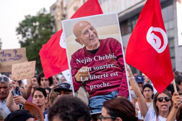 Protesters March Against Tunisian President Kais Saied - Tunis Protesters march through central Tunis, Tunisia on August 20, 2026, against President Kais Saied, demanding his resignation and greater political freedoms while calling for the release of detainees and opponents, as seen with portraits of Saied crossed out with the slogan DEGAGE and Tunisian flags, amid growing social unrest following weeks of extreme heat, water and electricity cuts, and shortages of essential medicines and products. Photo by Nicolas Fauque Images de Tunisie ABACAPRESS.COM Tunis Tunisia  Copyright: xFauquexNicolas ImagesxdexTunisie ABACAx