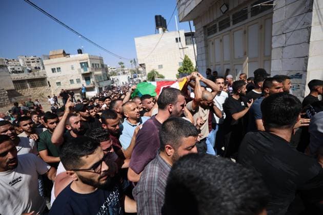August 21, 2026, Hebron, Palestine, State of: SAÃ¢â‚¬â ¢IR, HEBRON, WEST BANK, AUGUST 21, 2026: Palestinians attend the funeral of 17-year-old Karim Sand Shalaldeh in the village of SaÃ¢â‚¬â ¢ir, east of Hebron, after he was killed during a settler attack on the village earlier in the day. Several Palestinians were also injured and a house was set on fire during the attack. Hebron Palestine, State of  - ZUMAq101 20260821_zna_q101_096 Copyright: xMosabxShawerx
