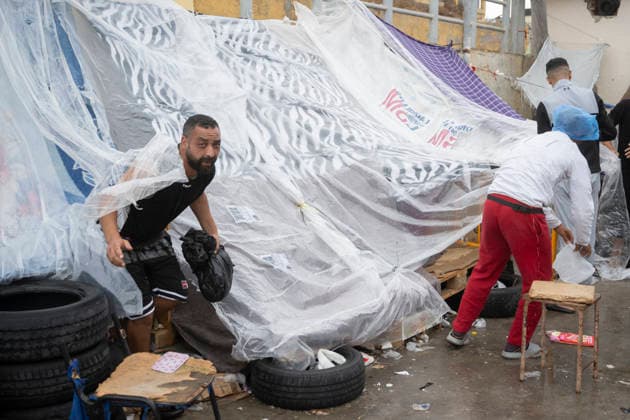 The humanitarian crisis in Ceuta continues. Migrants camped out in the Tarajal warehouses, August 21, 2026, in Ceuta, Spain. Ceuta continues to face a serious humanitarian crisis following the historic mass influx of more than 70,000 migrants who swam across the Tarajal on July 30 and 31. Although the police deployment and border reinforcement by Moroccan authorities have succeeded in curbing the influx, the autonomous city continues to face a serious humanitarian, health, and security crisis. AUGUST 21, 2026 Spain  Copyright: xMarcosxMorenox 7724460