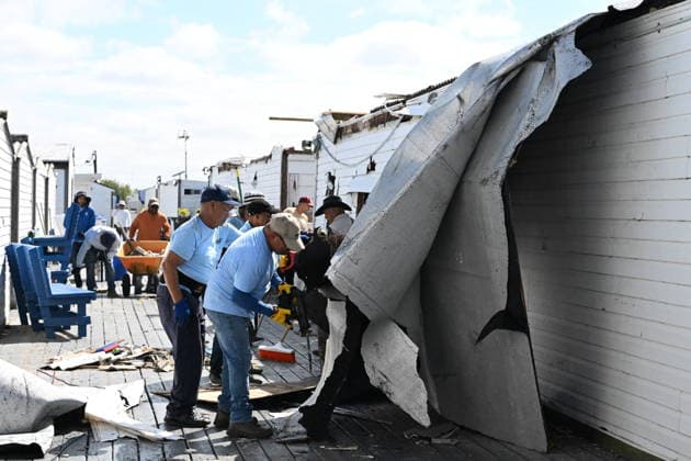 Tornado damage at Atlantic Beach in Long Island, New York NEW YORK, UNITED STATES - AUGUST 21: Emergency personnel and cleanup crews work amidst debris at the Sun and Surf Beach Club in Atlantic Beach, Long Island, New York, United States on August 21, 2026, following a rare tornado touchdown. The storm made landfall at approximately 7:11 p.m. on Thursday evening as a waterspout before moving ashore, destroying roughly 50 cabanas and tearing off roofs across the facility while nearly 100 people were present. Nassau County declared a state of emergency overnight as search teams swept the property, reporting only one minor injury, while the National Weather Service officially confirmed the tornadic event on Friday morning Kyle Mazza Anadolu  Copyright: x2026xAnadoluxKylexMazzax