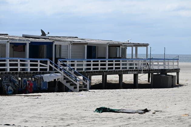 Tornado damage at Atlantic Beach in Long Island, New York NEW YORK, UNITED STATES - AUGUST 21: Emergency personnel and cleanup crews work amidst debris at the Sun and Surf Beach Club in Atlantic Beach, Long Island, New York, United States on August 21, 2026, following a rare tornado touchdown. The storm made landfall at approximately 7:11 p.m. on Thursday evening as a waterspout before moving ashore, destroying roughly 50 cabanas and tearing off roofs across the facility while nearly 100 people were present. Nassau County declared a state of emergency overnight as search teams swept the property, reporting only one minor injury, while the National Weather Service officially confirmed the tornadic event on Friday morning Kyle Mazza Anadolu  Copyright: x2026xAnadoluxKylexMazzax