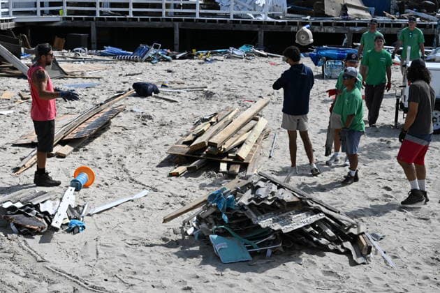 Tornado damage at Atlantic Beach in Long Island, New York NEW YORK, UNITED STATES - AUGUST 21: Emergency personnel and cleanup crews work amidst debris at the Sun and Surf Beach Club in Atlantic Beach, Long Island, New York, United States on August 21, 2026, following a rare tornado touchdown. The storm made landfall at approximately 7:11 p.m. on Thursday evening as a waterspout before moving ashore, destroying roughly 50 cabanas and tearing off roofs across the facility while nearly 100 people were present. Nassau County declared a state of emergency overnight as search teams swept the property, reporting only one minor injury, while the National Weather Service officially confirmed the tornadic event on Friday morning Kyle Mazza Anadolu  Copyright: x2026xAnadoluxKylexMazzax