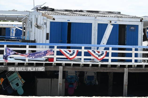 Tornado damage at Atlantic Beach in Long Island, New York NEW YORK, UNITED STATES - AUGUST 21: Emergency personnel and cleanup crews work amidst debris at the Sun and Surf Beach Club in Atlantic Beach, Long Island, New York, United States on August 21, 2026, following a rare tornado touchdown. The storm made landfall at approximately 7:11 p.m. on Thursday evening as a waterspout before moving ashore, destroying roughly 50 cabanas and tearing off roofs across the facility while nearly 100 people were present. Nassau County declared a state of emergency overnight as search teams swept the property, reporting only one minor injury, while the National Weather Service officially confirmed the tornadic event on Friday morning Kyle Mazza Anadolu  Copyright: x2026xAnadoluxKylexMazzax
