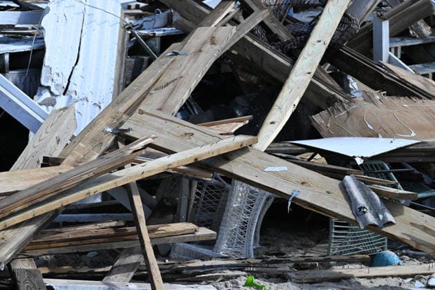 Tornado damage at Atlantic Beach in Long Island, New York NEW YORK, UNITED STATES - AUGUST 21: Emergency personnel and cleanup crews work amidst debris at the Sun and Surf Beach Club in Atlantic Beach, Long Island, New York, United States on August 21, 2026, following a rare tornado touchdown. The storm made landfall at approximately 7:11 p.m. on Thursday evening as a waterspout before moving ashore, destroying roughly 50 cabanas and tearing off roofs across the facility while nearly 100 people were present. Nassau County declared a state of emergency overnight as search teams swept the property, reporting only one minor injury, while the National Weather Service officially confirmed the tornadic event on Friday morning Kyle Mazza Anadolu  Copyright: x2026xAnadoluxKylexMazzax