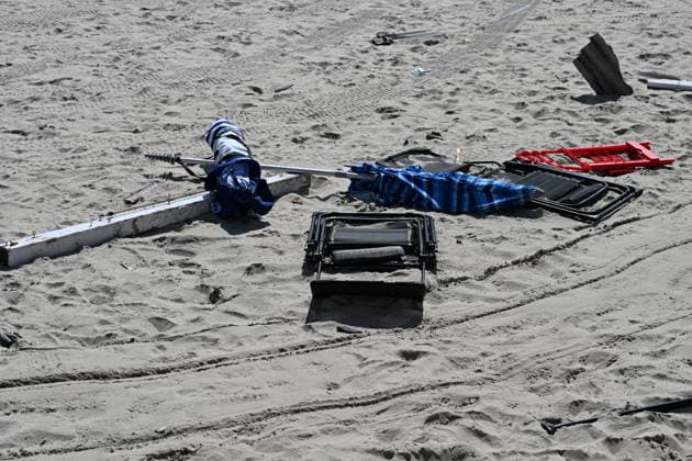 Tornado damage at Atlantic Beach in Long Island, New York NEW YORK, UNITED STATES - AUGUST 21: Emergency personnel and cleanup crews work amidst debris at the Sun and Surf Beach Club in Atlantic Beach, Long Island, New York, United States on August 21, 2026, following a rare tornado touchdown. The storm made landfall at approximately 7:11 p.m. on Thursday evening as a waterspout before moving ashore, destroying roughly 50 cabanas and tearing off roofs across the facility while nearly 100 people were present. Nassau County declared a state of emergency overnight as search teams swept the property, reporting only one minor injury, while the National Weather Service officially confirmed the tornadic event on Friday morning Kyle Mazza Anadolu  Copyright: x2026xAnadoluxKylexMazzax