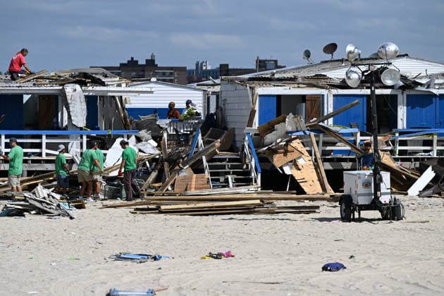 Tornado damage at Atlantic Beach in Long Island, New York NEW YORK, UNITED STATES - AUGUST 21: Emergency personnel and cleanup crews work amidst debris at the Sun and Surf Beach Club in Atlantic Beach, Long Island, New York, United States on August 21, 2026, following a rare tornado touchdown. The storm made landfall at approximately 7:11 p.m. on Thursday evening as a waterspout before moving ashore, destroying roughly 50 cabanas and tearing off roofs across the facility while nearly 100 people were present. Nassau County declared a state of emergency overnight as search teams swept the property, reporting only one minor injury, while the National Weather Service officially confirmed the tornadic event on Friday morning Kyle Mazza Anadolu  Copyright: x2026xAnadoluxKylexMazzax