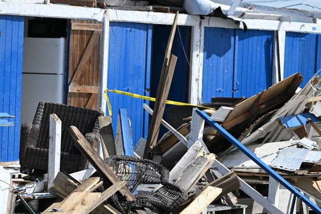 Tornado damage at Atlantic Beach in Long Island, New York NEW YORK, UNITED STATES - AUGUST 21: Emergency personnel and cleanup crews work amidst debris at the Sun and Surf Beach Club in Atlantic Beach, Long Island, New York, United States on August 21, 2026, following a rare tornado touchdown. The storm made landfall at approximately 7:11 p.m. on Thursday evening as a waterspout before moving ashore, destroying roughly 50 cabanas and tearing off roofs across the facility while nearly 100 people were present. Nassau County declared a state of emergency overnight as search teams swept the property, reporting only one minor injury, while the National Weather Service officially confirmed the tornadic event on Friday morning Kyle Mazza Anadolu  Copyright: x2026xAnadoluxKylexMazzax