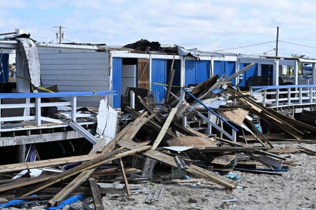 Tornado damage at Atlantic Beach in Long Island, New York NEW YORK, UNITED STATES - AUGUST 21: Emergency personnel and cleanup crews work amidst debris at the Sun and Surf Beach Club in Atlantic Beach, Long Island, New York, United States on August 21, 2026, following a rare tornado touchdown. The storm made landfall at approximately 7:11 p.m. on Thursday evening as a waterspout before moving ashore, destroying roughly 50 cabanas and tearing off roofs across the facility while nearly 100 people were present. Nassau County declared a state of emergency overnight as search teams swept the property, reporting only one minor injury, while the National Weather Service officially confirmed the tornadic event on Friday morning Kyle Mazza Anadolu  Copyright: x2026xAnadoluxKylexMazzax