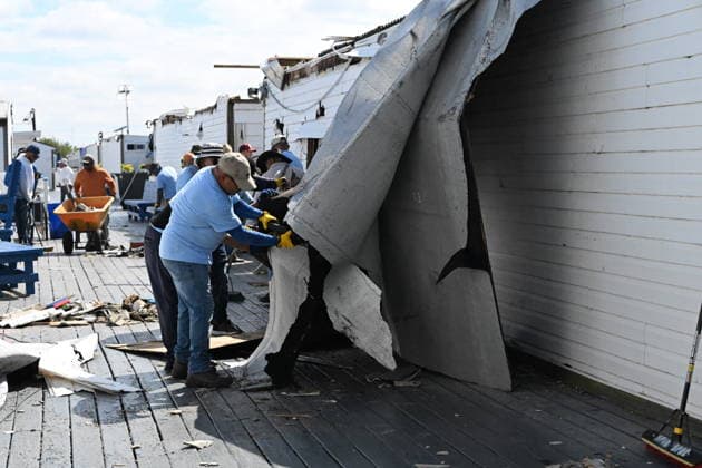 Tornado damage at Atlantic Beach in Long Island, New York NEW YORK, UNITED STATES - AUGUST 21: Emergency personnel and cleanup crews work amidst debris at the Sun and Surf Beach Club in Atlantic Beach, Long Island, New York, United States on August 21, 2026, following a rare tornado touchdown. The storm made landfall at approximately 7:11 p.m. on Thursday evening as a waterspout before moving ashore, destroying roughly 50 cabanas and tearing off roofs across the facility while nearly 100 people were present. Nassau County declared a state of emergency overnight as search teams swept the property, reporting only one minor injury, while the National Weather Service officially confirmed the tornadic event on Friday morning Kyle Mazza Anadolu  Copyright: x2026xAnadoluxKylexMazzax