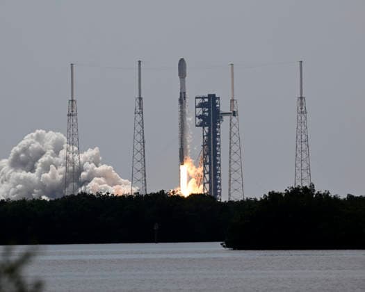 As viewed from the Complex 39 viewing site, SpaceX launches the Falcon 9 rocket carrying an additional 29 Starlink satellites on mission 10-39 at at 11:14 AM from Launch Complex 40 at the Cape Canaveral Space Force Station, Florida on Friday August 21, 2026.  CCP20260821002 JOExMARINO