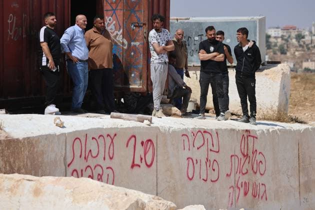 August 21, 2026, Hebron, Palestine, State of: AL-SAMU, HEBRON, WEST BANK, AUGUST 21, 2026: Traces of a settler arson attack targeting excavation machinery at an industrial rock and stone quarrying facility in Al-Samu, south of Hebron. Anti-Palestinian slogans are visible at the site following the attack. Hebron Palestine, State of - ZUMAq101 20260821_zna_q101_176 Copyright: xMosabxShawerx