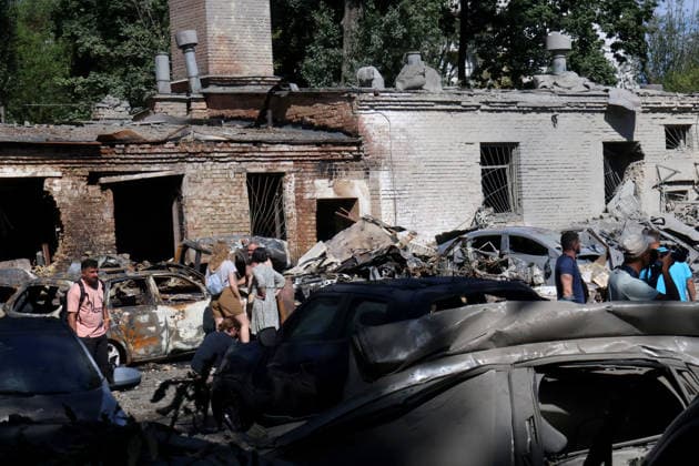 RECORD DATE NOT STATED Car owners inspect vehicles damaged in a Russian missile attack in Kyiv’s Solomianskyi district, Ukraine, on August 20, 2026. Eight people were killed in the district as a result of Russia’s overnight massive combined attack. At least 16 multi-storey residential buildings were damaged, including a nine-storey building whose upper floors were destroyed, as well as a school, a kindergarten and premises of a children’s hospital. State Emergency Service rescuers and municipal workers are dismantling hazardous structures and clearing debris at the impact sites. An emergency assistance centre has been set up for those affected (Photo by Pavlo Bahmut Ukrinform) Aftermath of Russian strike in Solomianskyi district of Kyiv  Copyright: xPavloxBahmutx