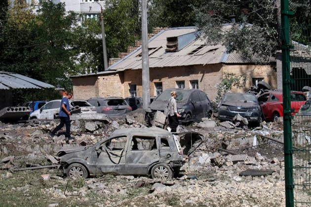 RECORD DATE NOT STATED Damaged civilian cars in the courtyard of a multi-storey residential building following a Russian missile attack in Kyiv’s Solomianskyi district, Ukraine, on August 20, 2026. Eight people were killed in the district as a result of Russia’s overnight massive combined attack. At least 16 multi-storey residential buildings were damaged, including a nine-storey building whose upper floors were destroyed, as well as a school, a kindergarten and premises of a children’s hospital. State Emergency Service rescuers and municipal workers are dismantling hazardous structures and clearing debris at the impact sites. An emergency assistance centre has been set up for those affected (Photo by Pavlo Bahmut Ukrinform) Aftermath of Russian strike in Solomia  Copyright: xPavloxBahmutx
